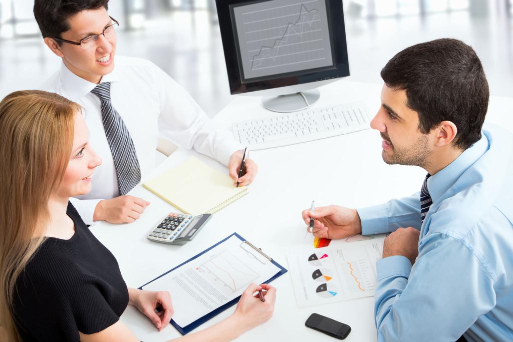 Business team in a meeting reviewing financial charts and documents